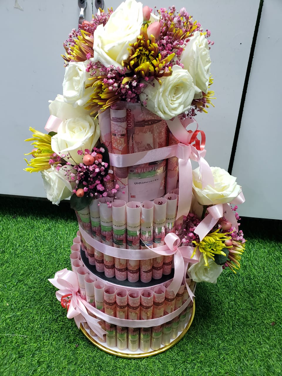 Luxury tiered flower and gift arrangement